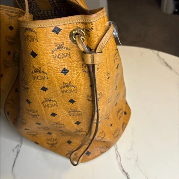 MCM | Bags | Mcm Cognac Visetos Drawstring Backpack | Poshmark display picture 1